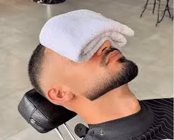 Corte de cabello + ritual afeitado toallas calientes + Masaje